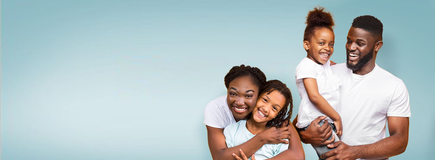 Smiling young family of four representing financial confidence, savings goals, and future planning.