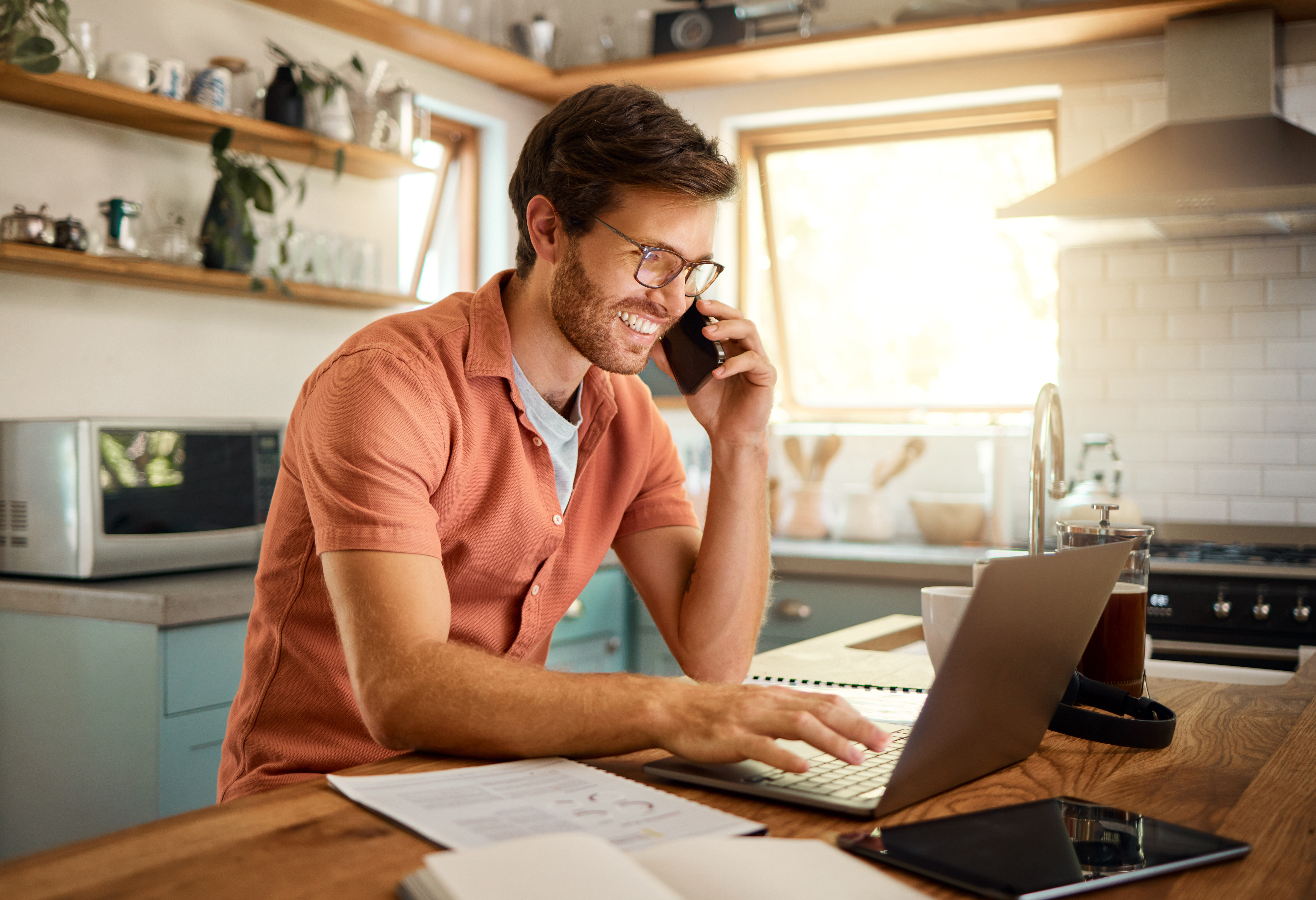 Landmark member on his cell phone talking the mortgage department with questions on his new loan. 