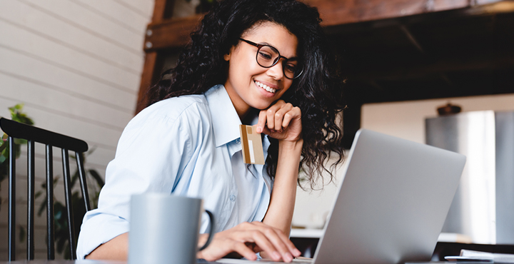 A student enrolled in college wears a smile of anticipation as they eagerly prepare to check their credit score.