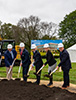 A group of Landmark executives in white helmets on groundbreaking day for the new corporate headquarters in Brookfield, WI.