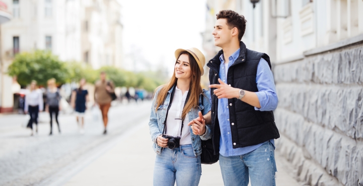 A couple is sightseeing and at ease knowing that they are keeping their finances safe as they travel.