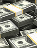 A stack of money in a pile, representing Landmark's $1 billion asset milestone.