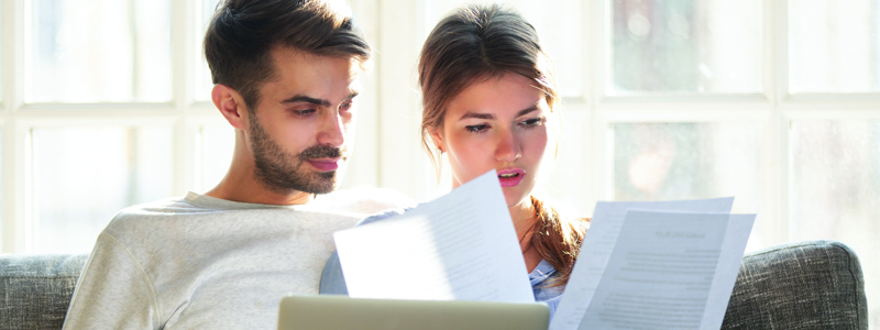 young-couple-looking-at-documents
