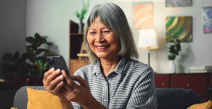 Woman planning healthcare expenses for retirement on her phone
