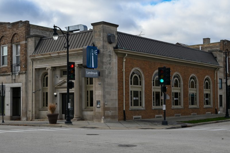 Exterior view of Cudahy Branch - White building with Landmark Credit Union sign on city street.