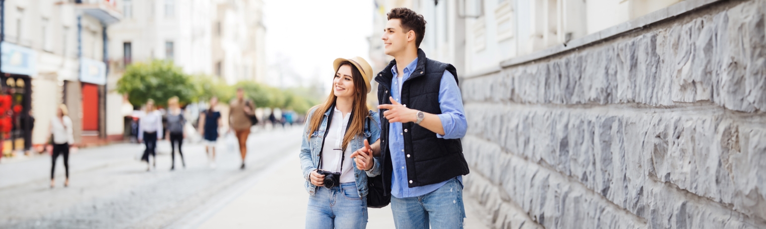 A couple is sightseeing and at ease knowing that they are keeping their finances safe as they travel.
