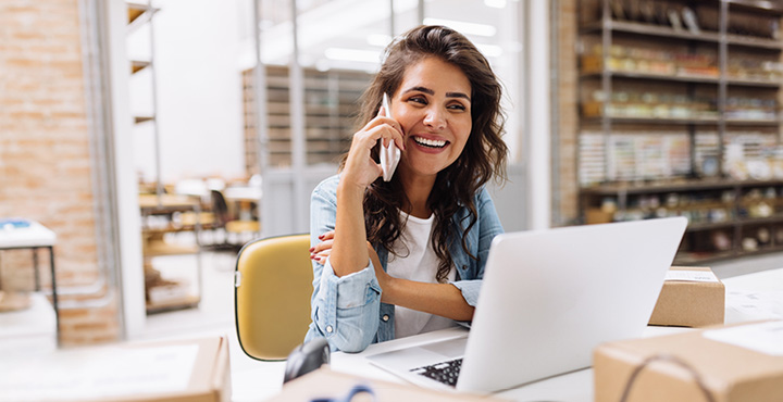 " A member with a smile on their face is on their phone, intrigued by the various ways they can engage in banking."
